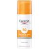 Eucerin Sun Fluid Anti-Age SPF50 - hvit sylinder formet flaske med pumpe og oransje lokk
